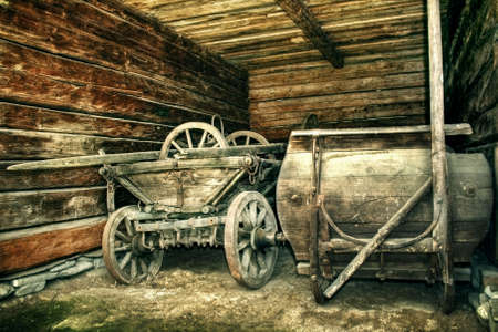 Old cart left in a wooden barn - vintage versionの写真素材