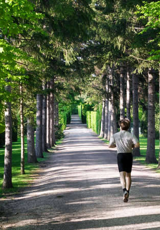 Jogging - Athletic man running in parkの写真素材