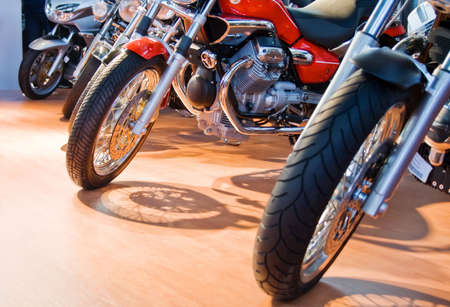 Front of powerful motorcycles aligned for saleの写真素材