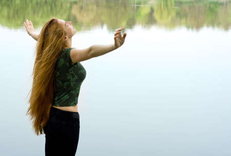 Freedom - girl with long hair imagining flying の写真素材