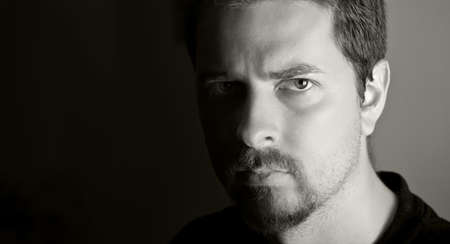 Low-key portrait of attractive young man (bw version)の写真素材