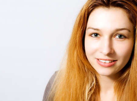 Portrait of charming young woman with lots of copy-space