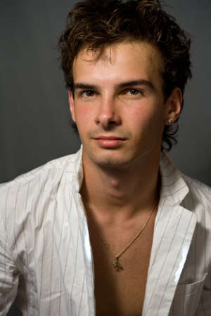 Portrait of handsome young man with nice hairの写真素材