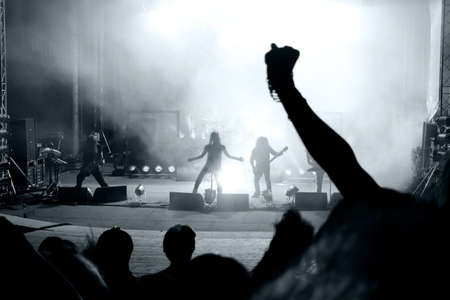 Scene from a rock concert with silhouette singerの写真素材