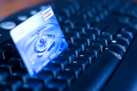 E-commerce concept: credit card on computer keyboardの写真素材