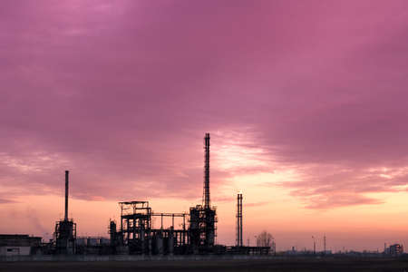 View of industrial chemical complex and dramatic polluted sky