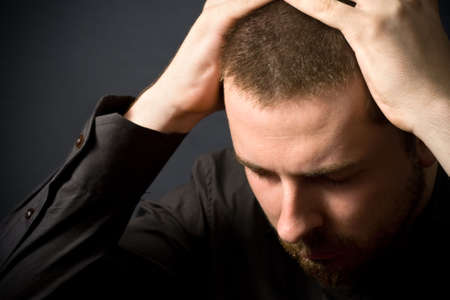 Frustrated businessman - business failure concept (or just a headache)の写真素材