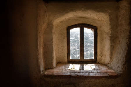Old window from interior of a medieval castleの写真素材
