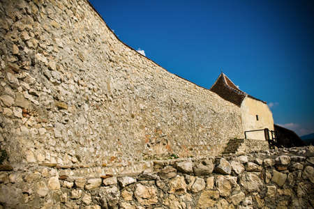 Big wall of ancient medieval fortress in Romaniaの写真素材