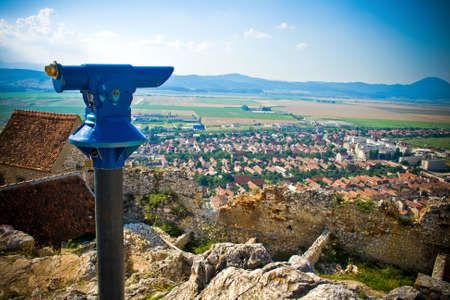 Panoramic view of rural romanian town - old binoculars in frontの写真素材