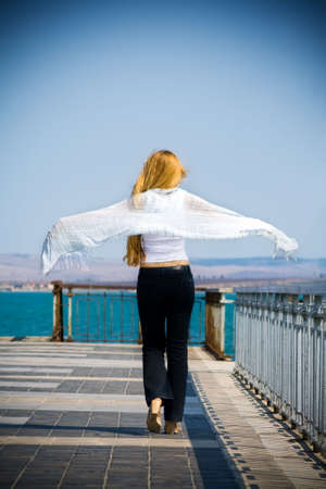 Back of young woman feeling the sense of freedomの写真素材