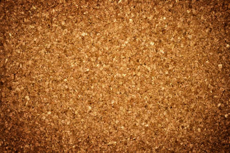 Grungy background: brown corkboardの写真素材