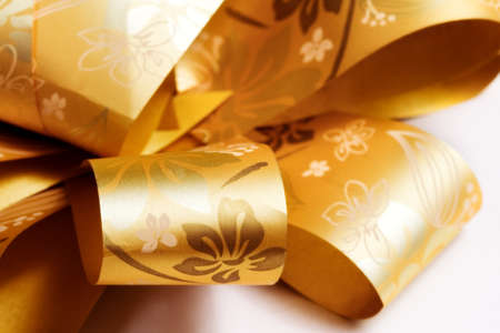 Extreme closeup on golden festive ribbon