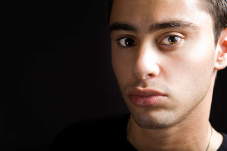 Closeup portrait of young man with sensual lipsの写真素材