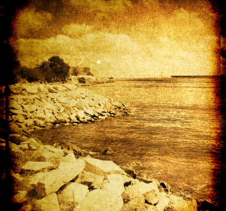 Vintage grungy seascape with dramatic skyの写真素材