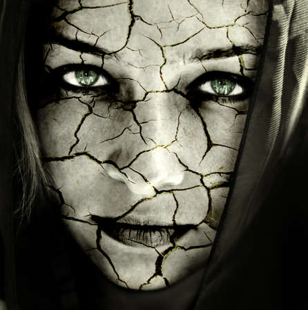 Global warming concept: face of woman with cracked skinの写真素材
