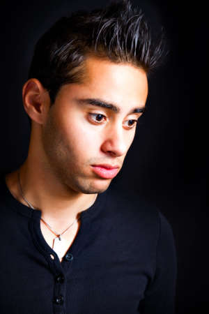 Portrait of pensive sad hispanic manの写真素材