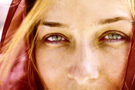 Closeup portrait of woman with beautiful green eyesの写真素材