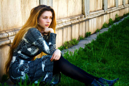 Solitude concept - sad pensive woman sitting aloneの写真素材