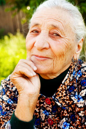 Smile of elegant content senior woman outdoorの写真素材