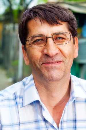 Smile of one mature happy business man outdoorの写真素材