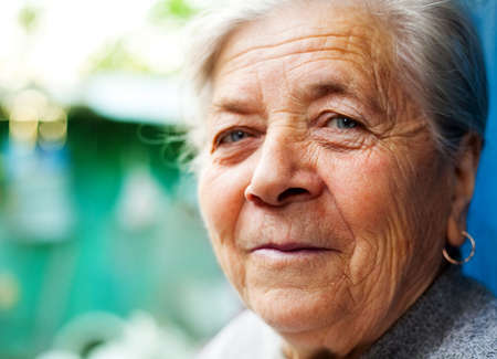 Smile of one content happy senior lady