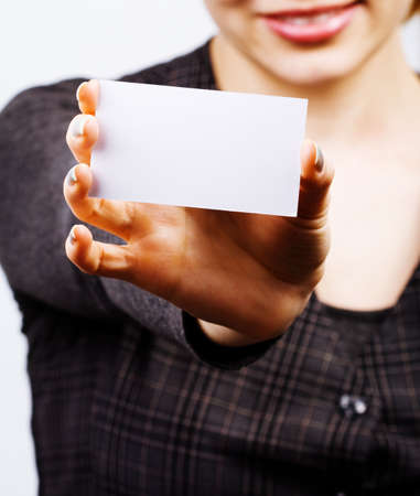 Female holding blank business cardの写真素材