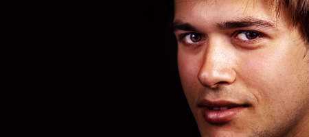 Face of handsome friendly guy with copy spaceの写真素材