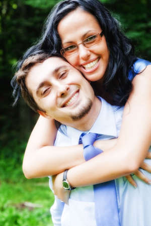 Happy joyful young couple embracing outdoorの写真素材