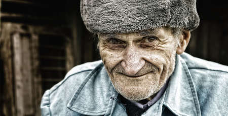 Candid smile of adorable wise senior manの写真素材