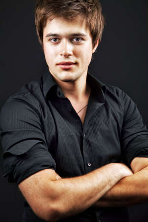 One handsome confident man with arms crossedの写真素材