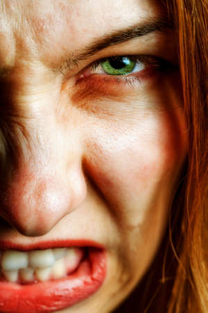 Face of angry woman with evil scary expressionの写真素材