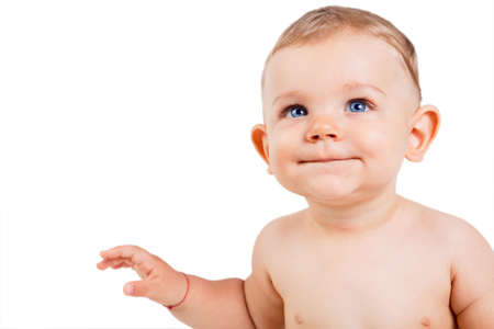 One baby boy child isolated on white and looking upの写真素材