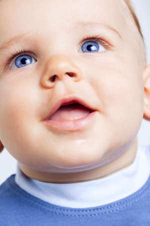 Portrait of happy cute baby boy with blue eyesの写真素材