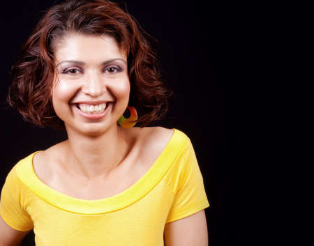 One happy joyful woman isolated on black backgroundの写真素材