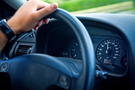 Hand of man driving a carの写真素材