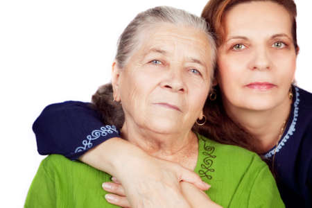 Family portrait - happy daughter and her old motherの写真素材