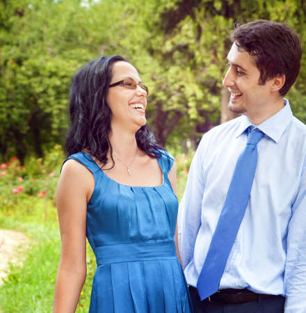 Happy joyful couple laughing outdoorsの写真素材