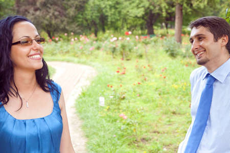 Flirting happy couple having fun outdoorの写真素材