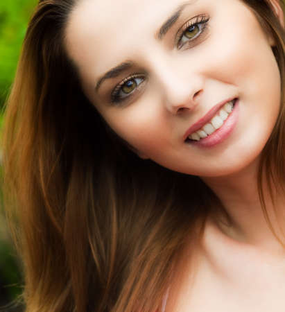 Candid portrait of happy young woman outdoorの写真素材