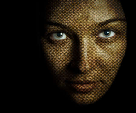 Fantasy portrait of woman with textured skin maskの写真素材