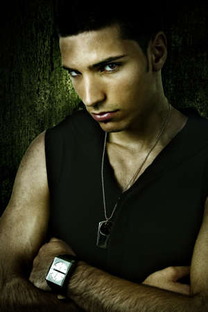 Grunge portrait of tough cool sexy young manの写真素材