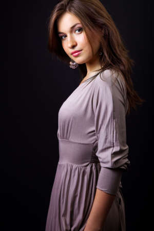 Studio portrait of sexy elegant young slim womanの写真素材