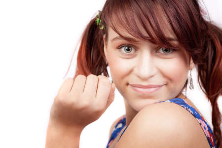 Smile of cute playful teen woman over whiteの写真素材