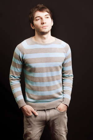 Studio portrait of one handsome young guyの写真素材
