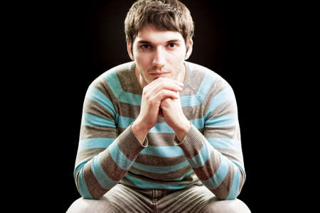 Handsome confident man isolated on black backgroundの写真素材