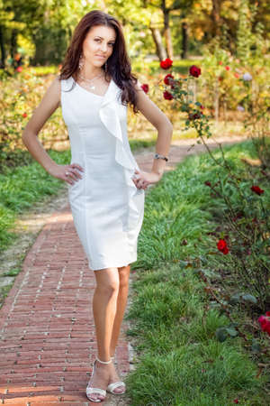 Sexy woman in elegant white dress outdoorsの写真素材