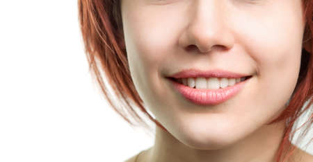 Young woman with perfect fresh teeth and lipsの写真素材
