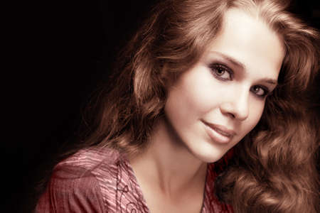 Feminine sensual woman with beautiful shiny hairの写真素材