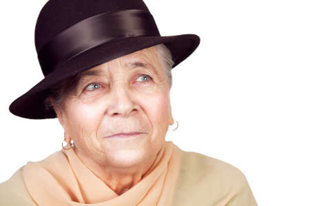 Elegant old senior woman with hat over whiteの写真素材